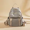 Sacos escolares mochila para mulheres moda meninas 2023 sac oxford pano elegante mochila casual lona à prova dwaterproof água saco de viagem estilo coreano