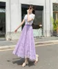 Kjolar koreanska mode spetsar midi kjol kvinna fast färg ihålig ut maxi långa svarta kvinnor veckade hög midja jupe saias foder