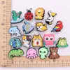 Großhandel 100 Stücke PVC Delphin Eidechse Löwe Frosch Schuh Charms Schöne Katze Tiere Zubehör Für Kinder Armband Knopf Clog