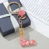 Keychains Lanyards Togory Pink Purple Pompom Letter Keychain English Alphabet Keyring For Women Men smycken Tillbehör Partihandel Specialerbjudande 230831