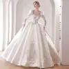 2023 Charmig Beach A Line Abiti da sposa per la sposa Donna Boho Plus Size Maniche lunghe Fiori di pizzo Sheer Jewel Neck Backless Court Train Abito da sposa Abiti da sposa