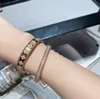 Brazalete de diseñador de marca de lujo, brazalete de cobre con cristal completo de trébol de cuatro hojas y flores para mujer, joyería con caja de regalo de fiesta