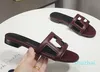 Designer platte schoenen Luxe slipper dames Geborduurde sandalen Mode Slippers Alfabet Slipper dames Zomer strandglijbaan Lage hakken voor dames