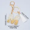 Nyckelringar Lanyards 26 Initialer Letter Key Chain White Fluffy Pompom Tassel Pendant Ornaments Gifts AZ Alphabet Keyring Harts Car Handbag Keychain 230831