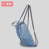 Tie-dyed denim drawstring cuffed backpack with tassel canvas outdoor sports and fitness bag, fashionable and simple shoulder bag 230831