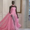 Wearing a princess-like pink tulle tube top and a long zuhair Murad dress, she suddenly appeared at the 2023 press conference.