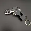 key chains alloy plastic M1 mini pendant folding rubber band gun can be used for 6 consecutive children's toy soft bullet gun.