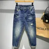 Mäns jeans vintage mager jeans för män tvätt blekning slitage rippad mode gata casual elasticitet bomull manlig denim byxor 230301