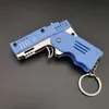 key chains alloy plastic M1 mini pendant folding rubber band gun can be used for 6 consecutive children's toy soft bullet gun.