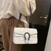 Bolso de mensajero de mujer con patrón de onda de marca al por mayor de fábrica bolsos de cadena de diamantes clásicos bolso de hombro de cuero con diamantes de ambiente elegante