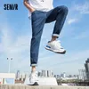 Jeans masculinos Jeans semir Men Spring Slim Feet Man Denim Troushers estilo coreano Calças de tendência azul da moda Blue 230301