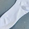 Nouveau 22ss printemps et été Rhude rouge et bleu flèche lettres coton tendance sport chaussettes moyennes hommes et femmes chaussettes de mode ins