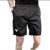 Prrrada Brands Shorts Clássico Moda Luxo Estilista Mens Praia Calça Tendência Verão Homem Senhora Respirável Secagem Rápida Fina Cor Sólida Calça de Moletom Esportiva Casual