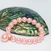 Strand imitazione conchiglia perla perline tonde di alta qualità color caramella rosa 10mm ragazze regalo di bellezza braccialetto corda elastica gioielli 7,5 pollici B1711