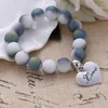 Strand Atreus Bracciale elastico con perline sfumate smerigliate Bracciale da coppia per gioielli da uomo con lettere d'amore da donna