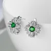 Studörhängen lyxig glansig silverfärg inlagd grön zirkon brudgagemangsmottagning bröllopsdag smycken