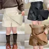 Skirts Autumn Winter Girls Pu Skirt Baby Skirt Shorts Kids Fake Skirt Children Bottoms Fashion Faux Leather Irregular Button 1 To 7 Yrs T230301