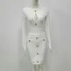 Casual jurken vrouwen lente sexy sleutelhangjes gaten met lange mouwen knop witte mini bodycon bandage jurk 2023 elegante avond feestvestidos