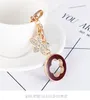 Keychain criativo de cinco folhas com requintado Diamond Fashion Car Pinging Key Ring for Women's Bag Charm Gift