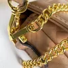 Mini sac baguette emblématique en cuir nappa souple porté à la main ou porté à l'épaule ou en bandoulière