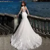 Nuova illusione di arrivo Vedi attraverso l'abito da sposa sirena di pesce elegante boutique in pizzo da sposa da sposa a maniche lunghe.