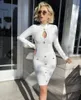 Casual jurken vrouwen lente sexy sleutelhangjes gaten met lange mouwen knop witte mini bodycon bandage jurk 2023 elegante avond feestvestidos