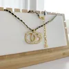 Kanal dubbel bokstav hänge halsband 18k guld pläterad lyxdesigner crysatl pärla sträng tröja tröja halsband för kvinnor bröllopsfest juveler tillbehör