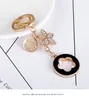 Keychain criativo de cinco folhas com requintado Diamond Fashion Car Pinging Key Ring for Women's Bag Charm Gift