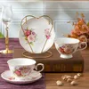 Tassen Untertassen Keramik Kaffeetasse und Untertasse Set Nachmittagstee Blume Retro europäische Tassen mit 4 Porzellanzubehör