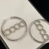 Grandes créoles classiques. Créateur de boucles d'oreilles de luxe en argent 925 plaqué or 18 carats et plaqué argent pour femme. Bijoux de créateur de haute qualité avec coffret cadeau avec tampon