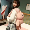 Nouvelle poupée oreille lapin poupée rétractable ins mignon peluche lapin poupées jouet ventes directes d'usine