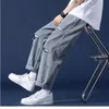 Herrbyxor rippade jeans mens 2023 sommar lösa breda ben beskurna koreanska trendiga modemärken raka manliga klädbyxor