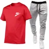 Mode masculine chemise survêtement deux pièces ensembles hommes décontracté Fitness Sport costume à manches courtes t-shirt pantalon hommes décontracté Sportswear costumes marque LOGO imprimer