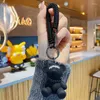 Keychains Spiral Elastic Spring Rope Hip Hop Bear Resin Doll Keychain Key Chain Couple Bag Charm Pendant Animal Car Accessories Gift