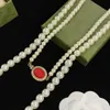 2023 Novos colares de miçangas de pérolas masculinas e femininas para a mesma cadeia de suéter para festas de casamento jóias de presentes