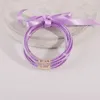 Braccialetti per tutte le stagioni Braccialetti per tutte le stagioni Stack Perline di plastica in silicone Bracciale in gelatina per le donne Riempire polvere d'oro Bowknot Amicizia Braccialetti glitterati