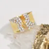 Bague pour femme à la mode avec effet de tréfilage en pierre CZ couleur or anneaux larges fête de bijoux féminins de luxe