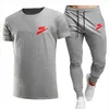 Neue sommer männer Trainingsanzüge rundhals T-shirt hosen sport anzug männer kurzarm hemd beiläufige sport anzug Marke LOGO Drucken