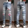 Patches de grife detalhados motociclistas ajustados de jeans MOTORCCIOL Slim para Moda Moda Menção Vintage Denim Jeans Jean calças