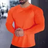 Camisetas masculinas machos de primavera e fitness esportes de fitness de fritura rápida camisa de manga comprida pescoço redonda cor sólida cor de fundo elástico apertado