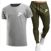 Menina de pista masculina calças de moletom 2 peças Conjunto de peças de roupas esportivas casuais Wear Wear Springsummer Novo Sportswear Brand Terne Brand Logo Print