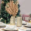 Flores decorativas 3pcs douradas 5 garfos tsubaki folhas decorações artificiais Ano Ornamentos de Natal Galhos de plantas de glitter de Natal