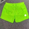 Shorts de designer de praia masculino de roupas de banho para mulheres curtas de luxo bordado rótulo de secagem rápida com malha de ioga esportiva respirável Summer x94x