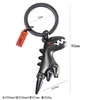 Keychains 2 färger Valfri Creative Söt dinosaurie Key Chain Gun Black Nickel Bronze Metal Pendant Ring Moveble Bag Keychain