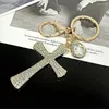 Keychains JINGLANG Trend Personality Full Rhinestones Cross Shape Car Key Chain Fashion Bag Pendant Gift