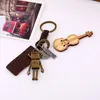 Keychains Vintage Bronze Alloy Robot Long Leather Pendant Men and Women Car Keyrings Backsack Charm Trendy smycken Tillbehör