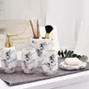 Set di accessori da bagno Ceramica nordica Struttura in marmo Disinfettante per le mani Bottiglia Portasapone Portaspazzolino Accessori per la casa Bagno in cinque pezzi