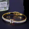 Bangle Bracciale gioielli in acciaio inossidabile stile invernale Bracciale a molla con fibbia aperta a doppia T tendenza femminile per le donneBangle