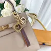 23 Leder Schlüsselanhänger Gold Designer Schlüsselanhänger Herren Damen Schlüsselanhänger Monogramm Tasche Auto Anhänger Luxus Schlüsselschnalle