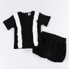 Ensembles de vêtements Ensemble bébé vêtements d'été 2pcs haut et bloomer noir côtelé enfants fille col rond manches courtes contraste volants 230303